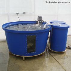 two large blue barrels with water in them