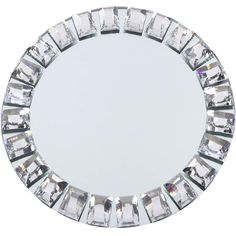 a round mirror that has many small pieces of glass around it on the bottom half