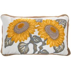 a yellow and gray pillow with two sunflowers on the front, sitting on a white background