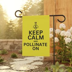 a yellow sign that says keep calm and pollinate on