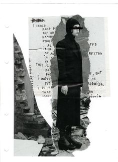 a black and white photo of a person wearing a mask, standing in front of a wall