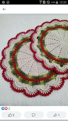 three crocheted coasters with red, green and white designs on the edges