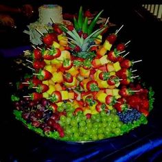 a platter filled with lots of different types of fruit