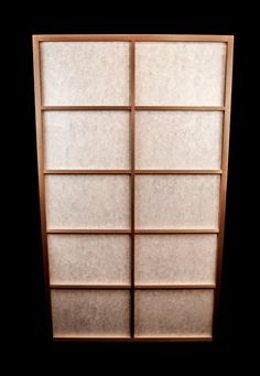 an empty bookcase is shown against a black background, with the bottom panel partially open