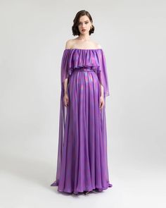 Step into the spotlight with our off-shoulder flared-cut purple evening dress, adorned with captivating ruffled details. Embrace elegance and grace in this striking ensemble. Purple Evening Dress, Dress Cape, Chiffon Dress Long, Unique Prom Dresses, Cut Dress, Pleated Bodice, Cape Dress, Dress Cuts, Chiffon Dress