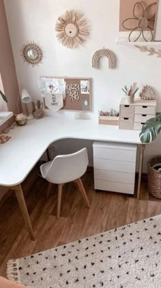 a white desk and chair in a room with wooden flooring on the walls, along with various decorations