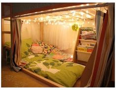 a bed with lights strung from the ceiling