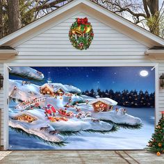 a christmas scene painted on the side of a garage