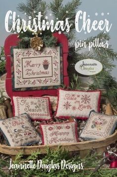 the cover of christmas cheer pin pillow pattern is displayed in front of a basket filled with ornaments