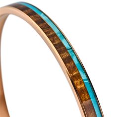 Our Koa wood and mother-of-pearl bangle makes a simple but elegant statement that showcases the natural elements we love here in Hawaii. The ocean and land are represented with a beautiful blue mother of pearl and our curly Koa wood respectively. The rose-gold color a reminder of the spectacular sunsets. The stainless band is light weight but sturdy and the inlay is coated with resin that protects it from the elements. All so you can wear our Koa bangle with confidence...we call it life-proof. T Natural Wood Jewelry Gift, Natural Wood Bracelet Jewelry Gift, Elegant Natural Wood Jewelry For Gift, Pearl Bangle Bracelet, Koa Wood, Pearl Bangle, Bangles Making, Simple Reminders, Knife Collection