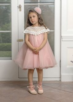 This Rosa Pink Tulle Flower Dress is perfect for any little girl's special occasion. The pink tulle material adds a touch of elegance, while the laser cut flowers on the back add a unique and delicate detail. Let your little one stand out in this stunning dress. Lace upper with sweet bow details Made in Turkey Fit is true to size and below the knee Fully lined  Back zipper and button closure 100% Polyester Care Instructions: Hand wash and hang to dry or dry clean. Tulle Flower Dress, Laser Cut Flowers, Tulle Material, Tulle Flowers, Pink Tulle, Rosa Pink, Flower Dress, Delicate Details, Petite Dresses