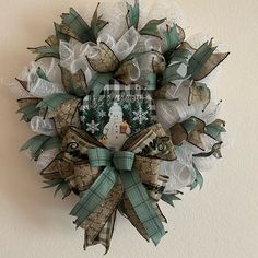 a snowman wreath hanging on the wall