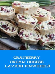 cranberry cream cheese lavash pinwheels are stacked on a platter