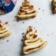 four pieces of food on a white surface