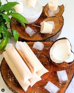 two wooden trays filled with food on top of a table