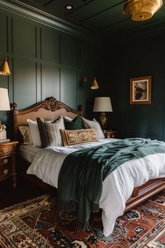 a large bed sitting on top of a wooden floor next to two lamps and a rug