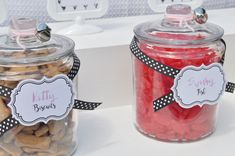 two jars filled with different types of candy