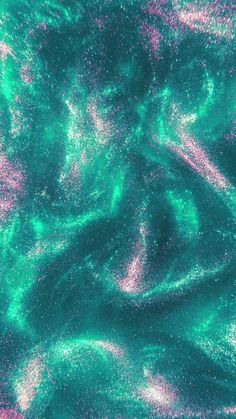 green and pink swirls are seen in this image from space, as well as the earth's surface