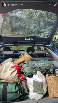 there are many bags in the back of this truck and it's packed up