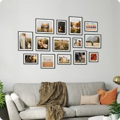 a living room filled with furniture and lots of pictures on the wall above it's couch