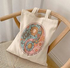 "Bohemian Tote Bag, Balance Over Hustle, Tote Bag, Bohemian Sun, Grocery Tote, Tote Bag, Gift For Her, Shopping Bag, Bohemian Gift This 100% cotton bag comes in one size - 15\" x 16\"- perfect for everyday wear. While the canvas material shows off our designs, it's durable and will last for years. The bag features 20\" handles (made from the same canvas), making it easy to carry even with a week's worth of shopping. 100% cotton canvas Heavy fabric (12 oz/yd² (406.9 g/m Sewn-in label" Bohemian Sun, Canvas Making, Grocery Tote, Cotton Bag, Sew-in Labels, Canvas Bag, Canvas Material, Gift Bags, Canvas Tote