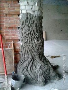 there is a tree that has been carved into the ground and some buckets are next to it