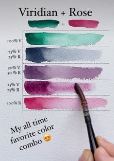 a person is holding a pen and writing on some paper with different colored inks