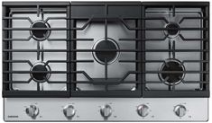 a stainless steel stove top with four burners