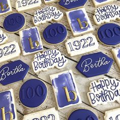 birthday cookies decorated with royal blue icing and gold numbers