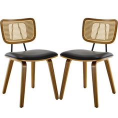 two wooden chairs with black leather seats