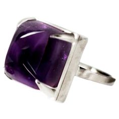 This Engagement ring is made of 18 karat white gold and sugarloaf cut natural amethyst (12x12 mm, 0,47x0,47 inches). When for most of the gem it works the way: the smaller prongs the better. This is the shape and size of the gem that we really enjoy to see avoiding the typical for sugarloaf childish look when the gem is too open. Therefore we balance huge gem with fitting amount of gold the way it makes it look more classy. This way we have a special influence on the whole look while wearing it, Purple Engagement Ring, Purple Engagement Rings, Red Tourmaline, Amethyst Ring Engagement, Paraiba Tourmaline, Aqua Marine, Rose Lights, Jewelry Rings Engagement, Purple Amethyst