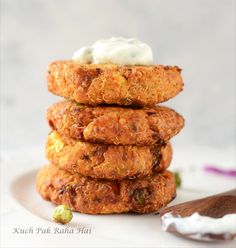 a stack of food sitting on top of a white plate