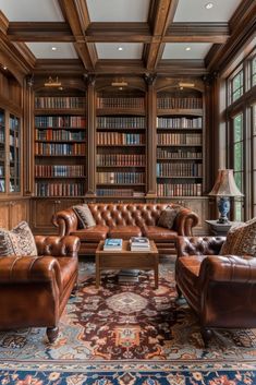 a living room filled with lots of brown furniture and bookshelves full of books