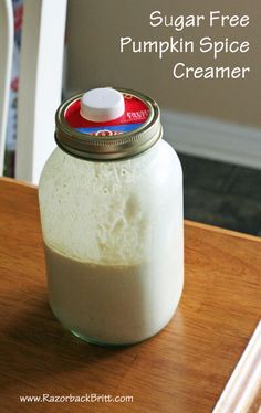 sugar free pumpkin spice creamer in a glass jar on a wooden table with text overlay