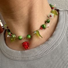 One of a kind fun flowery fruit necklace. 15inches long Casual Flower-shaped Beaded Necklace As Gift, Trendy Flower Shaped Beaded Necklaces As Gift, Trendy Flower Choker Necklace (gift), Trendy Flower Choker Necklace Gift, Trendy Flower Beaded Necklaces As Gifts, Trendy Flower Choker Necklace As Gift, Trendy Flower Choker Necklace For Gift, Trendy Green Jewelry With Fruit Design, Trendy Handmade Flower Necklace For Gift