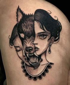 a woman with a wolf tattoo on her shoulder