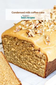 a loaf of cake with frosting and nuts on top