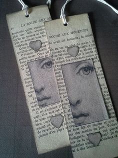 two bookmarks with faces on them are hanging from twine strings that have been made out of newspaper