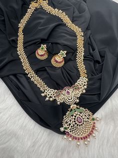 AD Red Green Multi Stone Peacock Pendent Golden Finish Long Necklace comes with Jhumkis Party wear golden finish American diamonds multi Color Necklace Pair it up with Saree Lehenga aur any Party wear dress. Necklace Length : Approx. 22 inches; Comes with adjustable back chain. Earring Length : .2 Inches Screw Back Ready to ship from Massachusetts, USA If you have any questions, Please let me know. Thank you!! Ad Necklace, Necklace Traditional, Dress Necklace, Back Chain, Jewelry Pakistani, Beautiful Chokers, Multi Coloured Necklaces, Chain Earring, Party Wear Dress