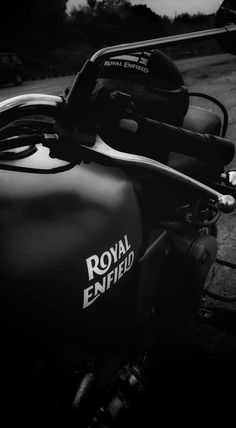 black and white photograph of royal enfield motorcycle