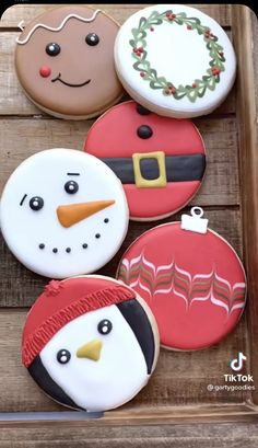 decorated christmas cookies in the shape of snowmen