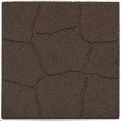 a close up view of the top of a tile floor with dark brown colored material