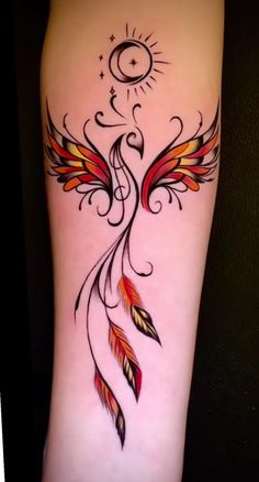 a tattoo design on the leg of a woman with an orange and red bird wing