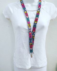 This boho style lanyard is made with a beautiful tribal cotton fabric. The ID badge holder is made from Guatemalan textile that is completely handwoven and handmade using the back strap loom technique. This is a very old style of weaving that is time consuming but the result is stunning details that appear hand embroidered. This fabric lanyard is woven on a light blue base. It is stunning with its bold colors and design, you definitely won't lose your keys with this! The woven technique and zigz Adjustable Multicolor Bohemian Lanyards, Bohemian Adjustable Lanyards For Everyday Use, Bohemian Handmade Lanyards As Gifts, Handmade Adjustable Multicolor Lanyards, Guatemalan Textiles, Boho Keychain, Fabric Lanyard, Badge Lanyard, Key Lanyard