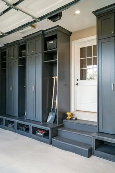 an empty garage with many gray cabinets