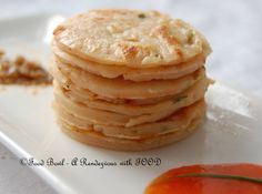 a stack of pancakes sitting on top of a white plate