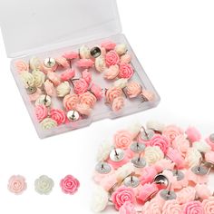 pink and white flowers are in a plastic container next to some silver metal studs