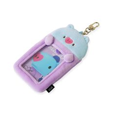 a keychain shaped like a phone case with a cartoon character on the front