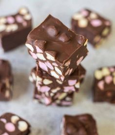 chocolate and marshmallows are stacked on top of each other in the shape of cubes