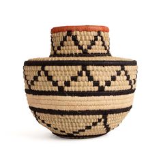 a black and white basket sitting on top of a table